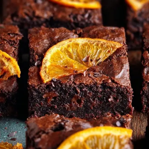 Deliciously moist Chocolate Orange Brownies topped with orange zest.