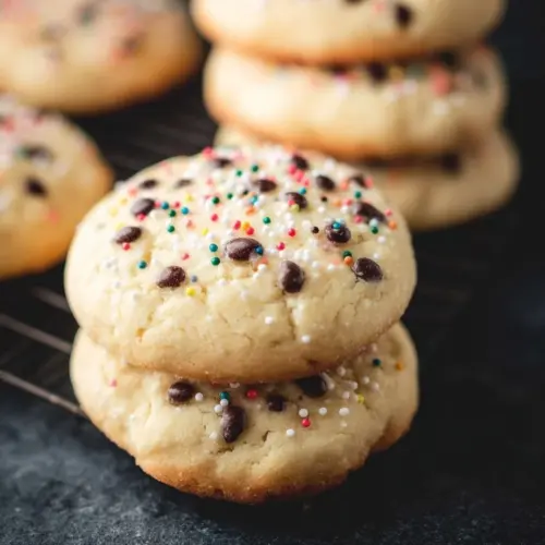 A variety of homemade cookies arranged on a plate, showcasing different flavors and textures.