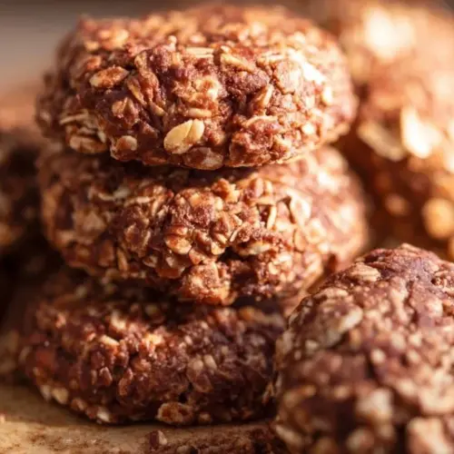 Healthy no bake cookies on a plate with ingredients around them